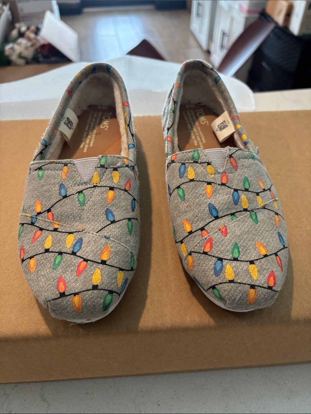 Toms Women’s Gray Canvas Slip-Ons with Christmas Glow in the Dark Light Print.